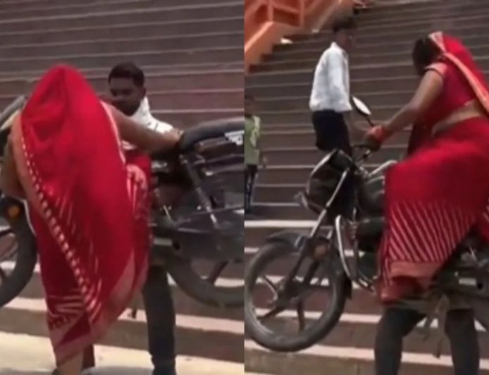 प्रतापगढ़ में रीलबाजी के चक्कर में पति बना बाहुबली, मंदिर के घाट पर पत्नी समेत बाइक को उठाया, वीडियो वायरल होते ही हरकत में आई पुलिस